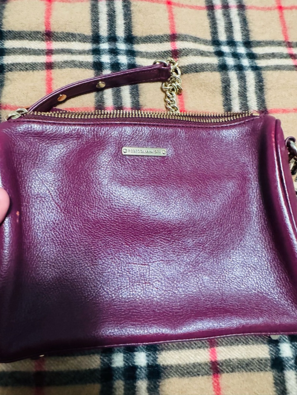 Rebecca Minkoff Mini 5-Zip Convertible Crossbody Bag in a pebbled burgundy